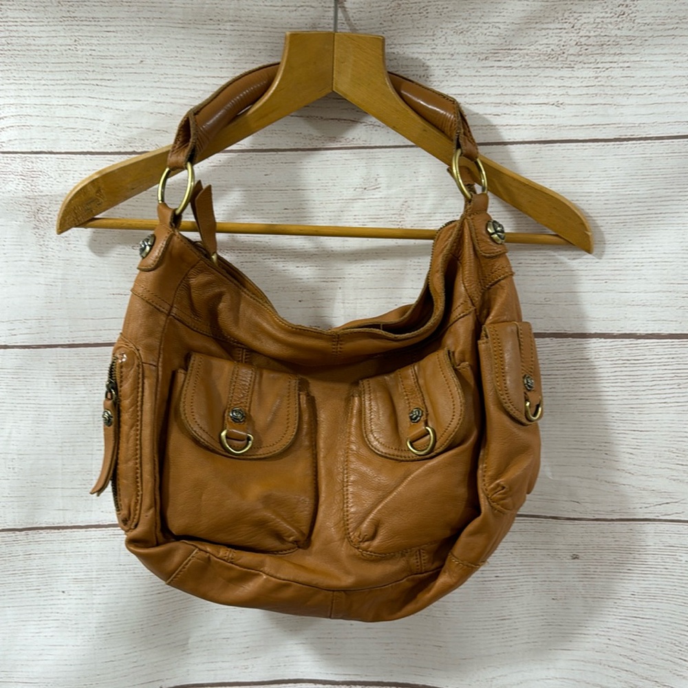 Gently used Tan leather shoulder from Anthropologie by Rough Roses
